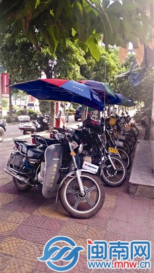 摩托车拆了遮阳伞后方可放行
